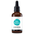 A 50ml amber glass dropper bottle of Viridian Organic Hair Restore Serum with a white label and a turquoise watercolor-style circle, isolated on a white background.