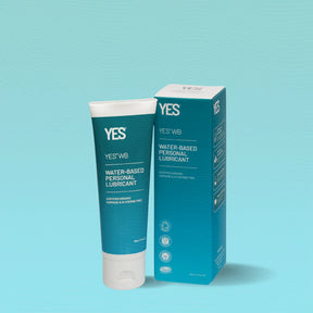 Tube and box of YES WB Water-Based Personal Lubricant on a light turquoise background. The packaging is teal and white, conveying a clean, fresh look.