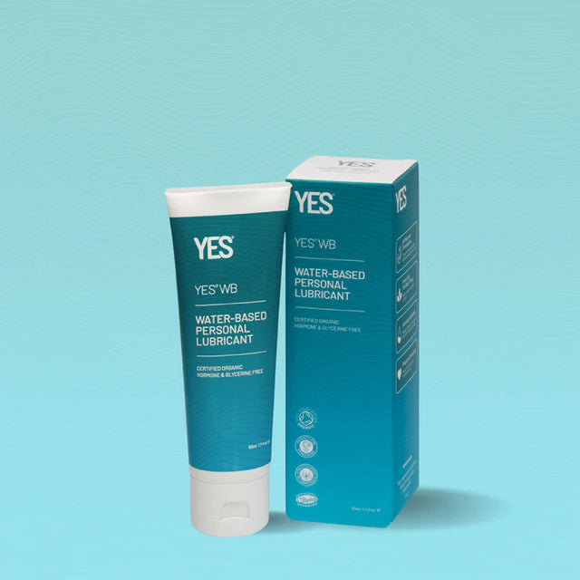 Tube and box of YES WB Water-Based Personal Lubricant on a light turquoise background. The packaging is teal and white, conveying a clean, fresh look.