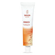 A white and orange tube of Weleda Arnica Cooling Gel featuring arnica flower illustrations and "Certified Natural Skin Care" branding.