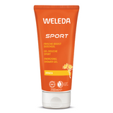 An orange 200ml tube of Weleda Sport Energising Shower Gel with Arnica, featuring yellow floral illustrations and labels in German, French, and English.