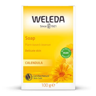 A yellow box of Weleda Calendula Soap, described as a plant-based cleanser for delicate skin, featuring orange calendula flower illustrations.