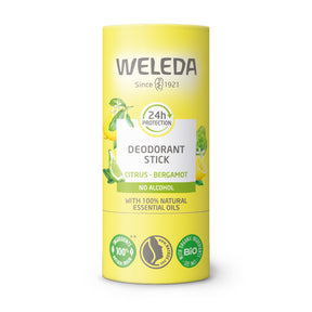 A yellow tube of Weleda Citrus-Bergamot Deodorant Stick featuring illustrations of citrus fruits, a "24h protection" icon, and "no alcohol" and "100% natural essential oils" labels.