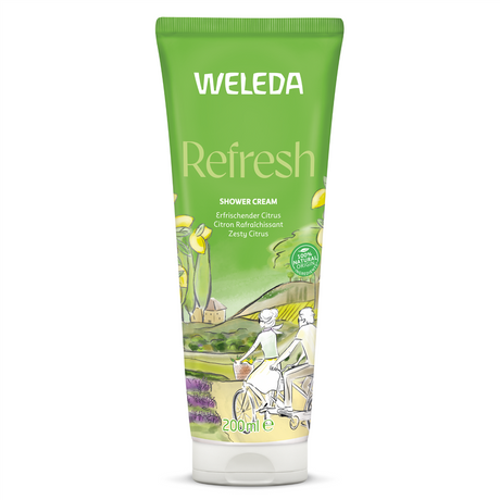A green 200ml tube of Weleda Refresh Shower Cream featuring "Zesty Citrus" text and an illustration of a couple riding bicycles through a sunny countryside landscape with lemon trees.