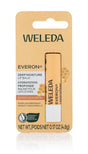 A single stick of Weleda Everon Deep Moisture Lip Balm in cardboard blister packaging, featuring rose and beeswax ingredients with a honeycomb illustration.