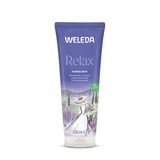 A purple 200ml tube of Weleda Relax Shower Cream featuring "Soothing Lavender" text and an illustration of a woman in a sun hat holding a bouquet of lavender in a scenic field.