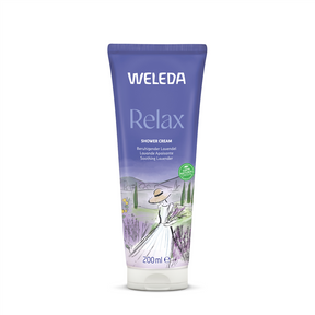 A purple 200ml tube of Weleda Relax Shower Cream featuring "Soothing Lavender" text and an illustration of a woman in a sun hat holding a bouquet of lavender in a scenic field.