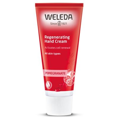 A red tube of Weleda Regenerating Hand Cream with "Pomegranate" text and an illustration of sliced pomegranate fruit.