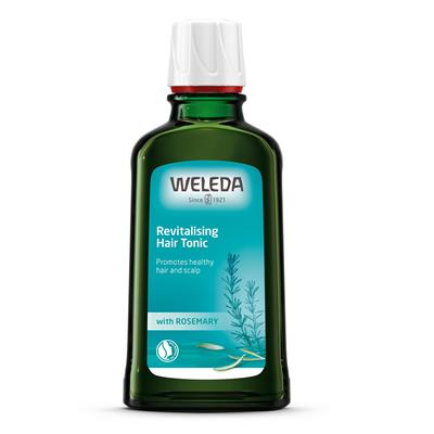 A dark green glass bottle of Weleda Revitalising Hair Tonic with Rosemary, designed to promote a healthy hair and scalp, featuring a light blue label and white cap.