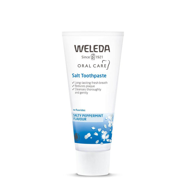 A white tube of Weleda Salt Toothpaste with blue accents, featuring "Salty Peppermint Flavour" and salt crystal illustrations.