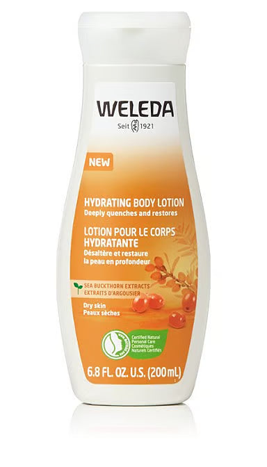A white bottle of Weleda Hydrating Body Lotion featuring an orange label with sea buckthorn extracts and berry illustrations, designed to deeply quench and restore dry skin.