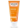 An orange tube of Weleda Replenishing Hand Cream with "Sea Buckthorn" text and an illustration of sea buckthorn berries.