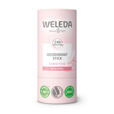 A light pink tube of Weleda Deodorant Stick for sensitive skin, featuring "24h protection" and "no alcohol" labels with organic certification icons at the base.