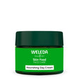 A green jar of Weleda Skin Food Nourishing Day Cream with a dark green lid and a white label strip at the bottom.