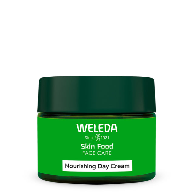 A green jar of Weleda Skin Food Nourishing Day Cream with a dark green lid and a white label strip at the bottom.