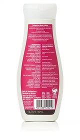 The back of a white Weleda body lotion bottle showing a pink label with a detailed list of ingredients, including wild rose oil and shea butter, and manufacturing information for the Wild Rose Pampering Body Lotion.