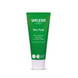 A green squeeze tube of Weleda Skin Food rich, intensive skin care cream with a white cap, centered on a plain white background.