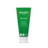 A green squeeze tube of Weleda Skin Food rich, intensive skin care cream with a white cap, centered on a plain white background.