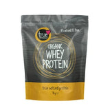 A 1kg grey and yellow resealable pouch of True Organic Whey Protein featuring a yellow circular logo and white text.