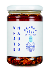 Glass jar of White Mausu Extra Hot Peanut Rayu featuring a white label with blue text.