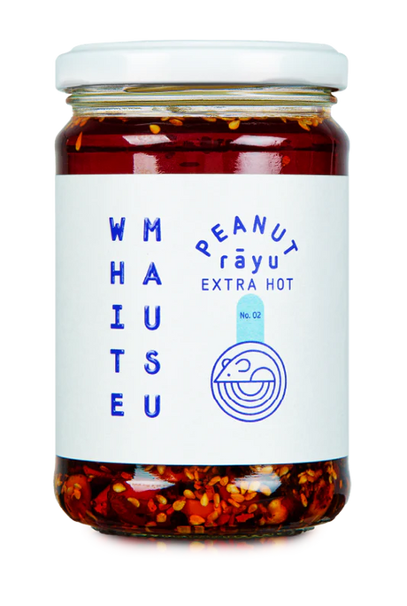 Glass jar of White Mausu Extra Hot Peanut Rayu featuring a white label with blue text.
