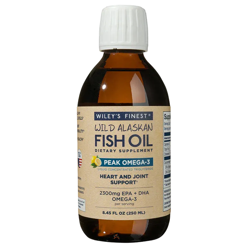 An 8.45 fl oz (250 ml) amber glass bottle of Wiley's Finest Wild Alaskan Fish Oil, Peak Omega-3 liquid dietary supplement for heart and joint support, featuring a white ribbed cap and a tan label with lemon imagery.