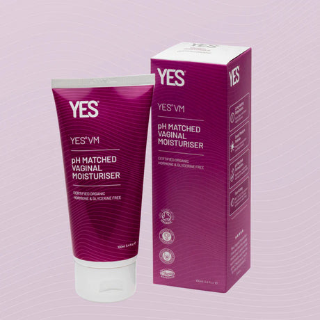 A tube and box of YES VM pH-matched vaginal moisturiser. The magenta-colored packaging is labelled as certified organic, hormone-free, and glycerine-free, with a volume of 100ml.