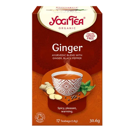 Yogi Tea Ginger tea box with a cup of tea and ginger root on a white background