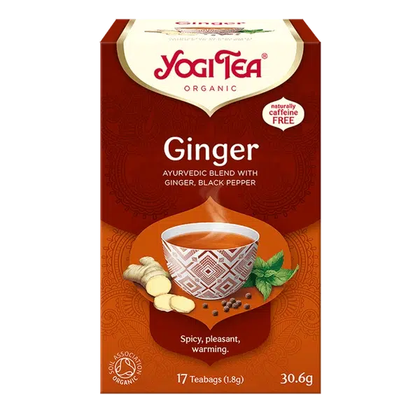 Yogi Tea Ginger tea box with a cup of tea and ginger root on a white background