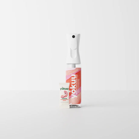 White Yokuu Probiotic Anti-Allergen Spray bottle with a white nozzle, pink label, and a matching refill sachet.