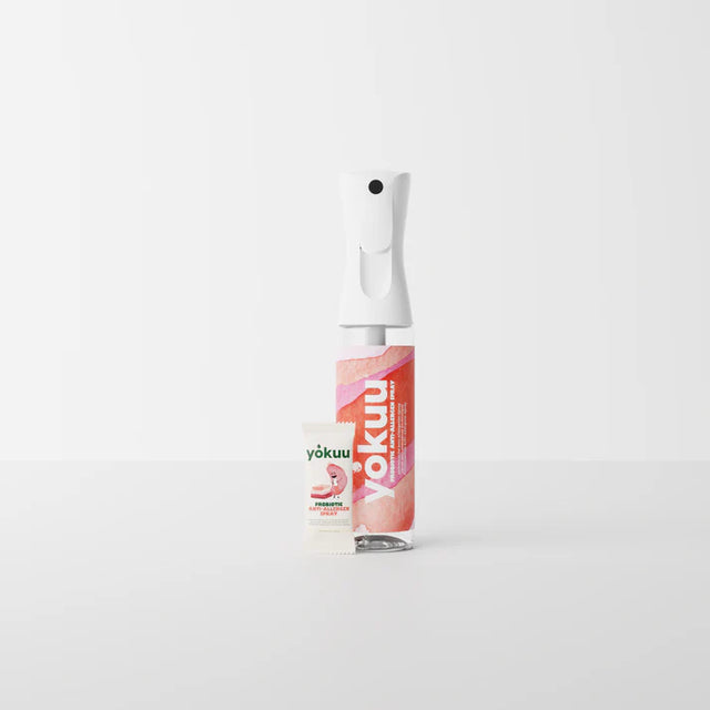 White Yokuu Probiotic Anti-Allergen Spray bottle with a white nozzle, pink label, and a matching refill sachet.