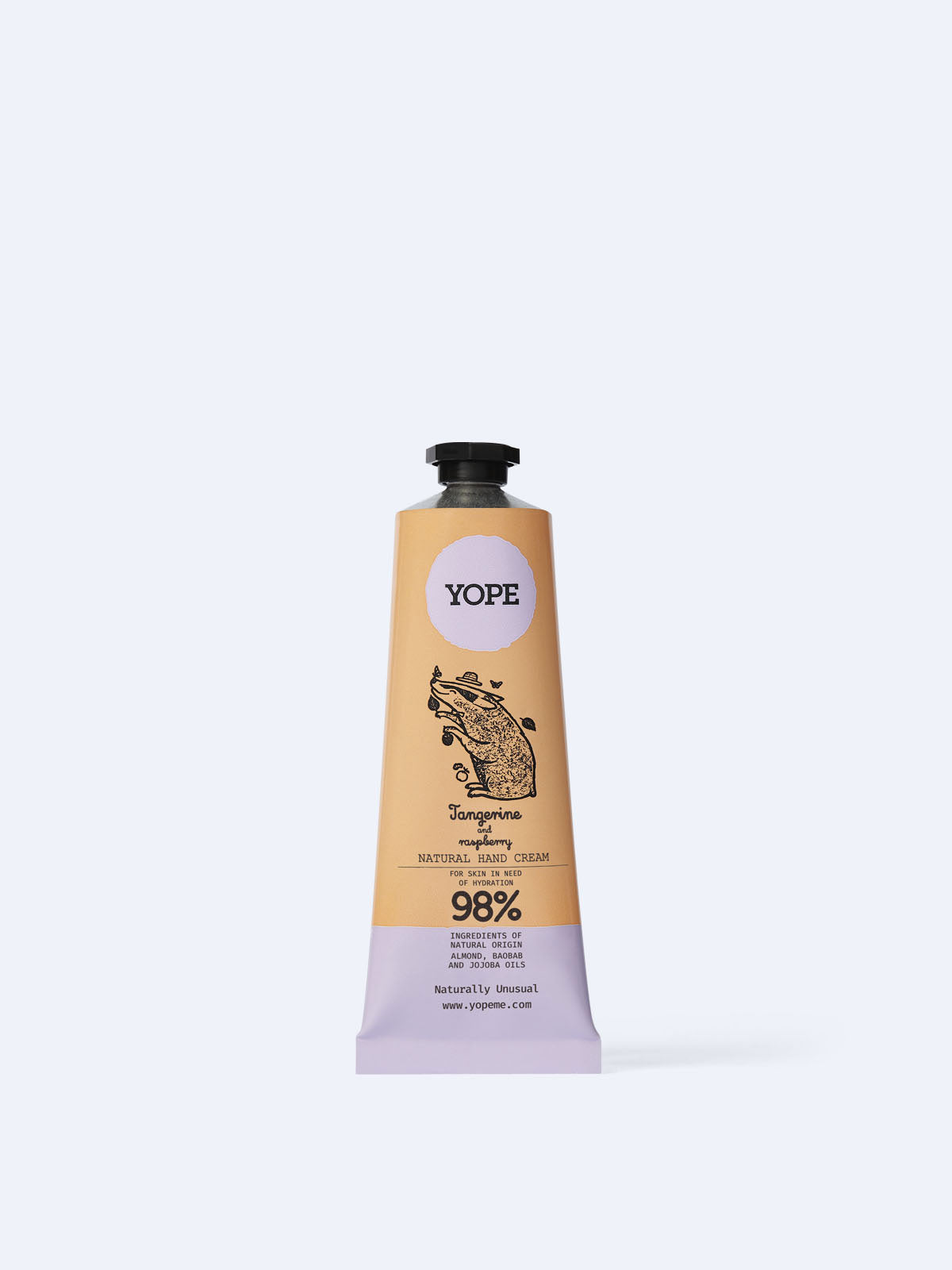 A tan and light purple tube of YOPE Tangerine and Raspberry natural hand cream featuring an illustration of a pig, labelled as 98% ingredients of natural origin.