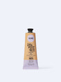 A tan and light purple tube of YOPE Tangerine and Raspberry natural hand cream featuring an illustration of a pig, labelled as 98% ingredients of natural origin.