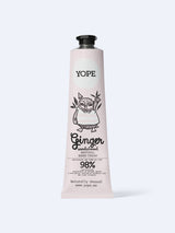 A light pink tube of YOPE Ginger & Sandalwood natural hand cream featuring an illustration of an owl, labelled as 98% low-processed ingredients of natural origin.