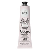 A light pink tube of YOPE Ginger & Sandalwood natural hand cream featuring an illustration of an owl, labelled as 98% low-processed ingredients of natural origin.