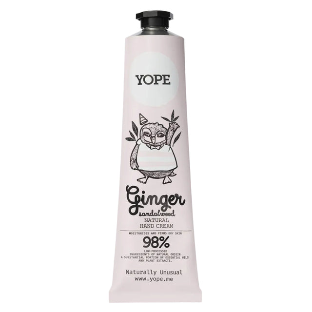 A light pink tube of YOPE Ginger & Sandalwood natural hand cream featuring an illustration of an owl, labelled as 98% low-processed ingredients of natural origin.