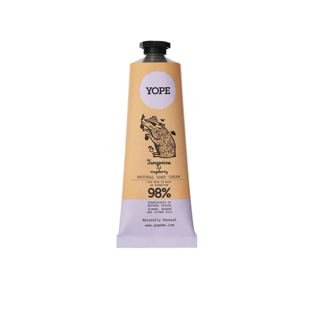 A tan and light purple tube of YOPE Tangerine and Raspberry natural hand cream featuring an illustration of a pig, labelled as 98% ingredients of natural origin.