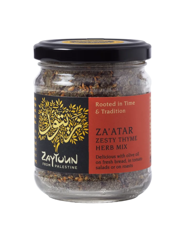 Small glass jar of Zaytoun Za'atar Zesty Thyme Herb Mix from Palestine, featuring a black lid and a red and black label with a gold tree logo.