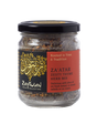 Small glass jar of Zaytoun Za'atar Zesty Thyme Herb Mix from Palestine, featuring a black lid and a red and black label with a gold tree logo.