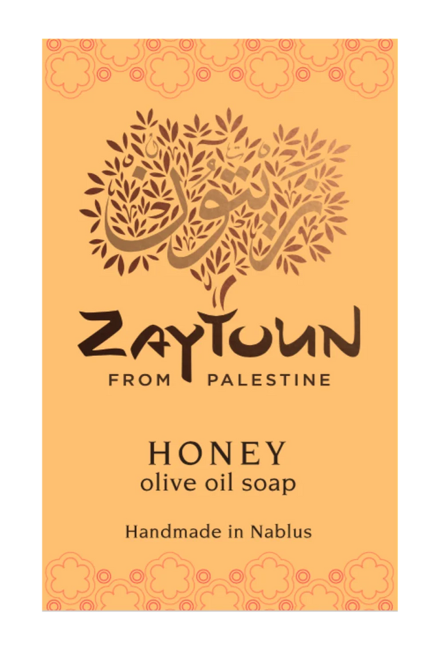 A rectangular soap bar label or packaging card for Zaytoun Honey Olive Oil Soap, featuring a warm orange background with a stylized olive tree logo and text reading 'Zaytoun From Palestine' and 'Honey olive oil soap Handmade in Nablus'.