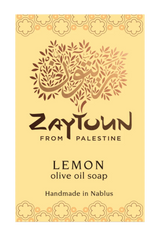 A rectangular soap bar labeled 'Zaytoun From Palestine Lemon olive oil soap' on a pale yellow background with decorative floral borders and a stylized tree logo.