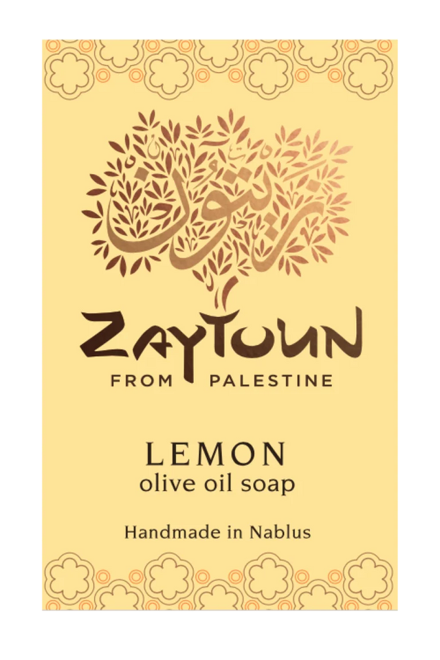 A rectangular soap bar labeled 'Zaytoun From Palestine Lemon olive oil soap' on a pale yellow background with decorative floral borders and a stylized tree logo.