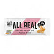 A wrapper for an Irish-made "All Real" natural protein bar in peanut butter flavor, noting it has plastic-free packaging, 16g of protein, and only 9 ingredients.