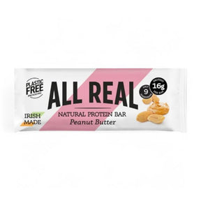 A wrapper for an Irish-made "All Real" natural protein bar in peanut butter flavor, noting it has plastic-free packaging, 16g of protein, and only 9 ingredients.