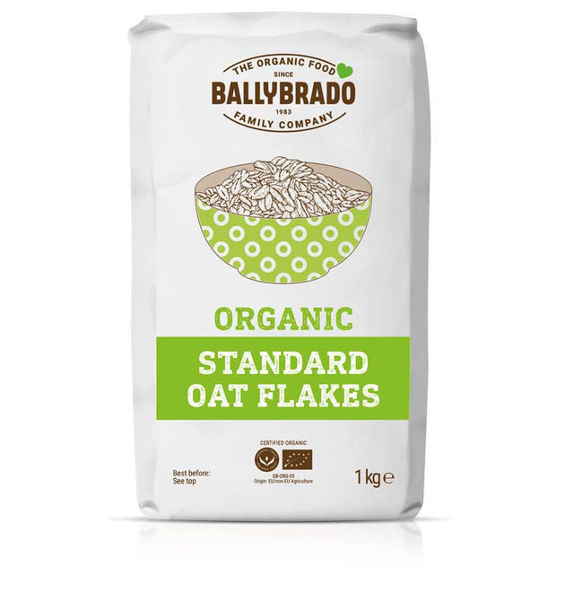Package of Ballybrado Organic Standard Oat Flakes. The white bag features a green bowl graphic and text, emphasizing natural, wholesome ingredients.