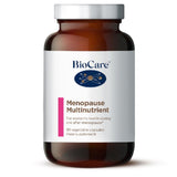 A 90-capsule amber glass jar of BioCare Menopause Multinutrient food supplement with a white and pink label and silver cap, isolated on a white background.