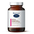 A 60-capsule amber glass jar of BioCare Methyl Pregnancy Multinutrient food supplement with a white and pink label and silver cap, isolated on a white background.