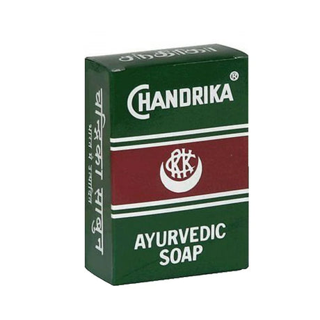 A box of Chandrika Ayurvedic Soap, featuring a dark green and maroon color scheme with white text and logo details, set against a plain white background.