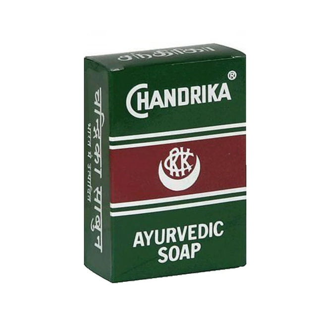 A box of Chandrika Ayurvedic Soap, featuring a dark green and maroon color scheme with white text and logo details, set against a plain white background.