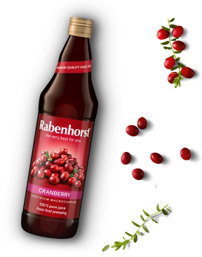 "Rabenhorst 100% pure cranberry juice from first pressing, featuring a premium glass bottle surrounded by fresh cranberries.